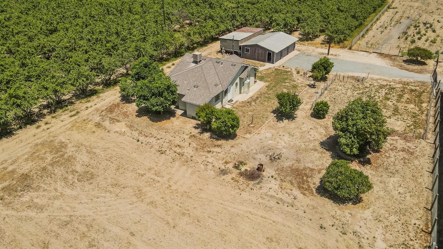 37991 Pound Road Dinuba, CA 93618 - Photo 11 of 32 an aerial view of a house with a yard