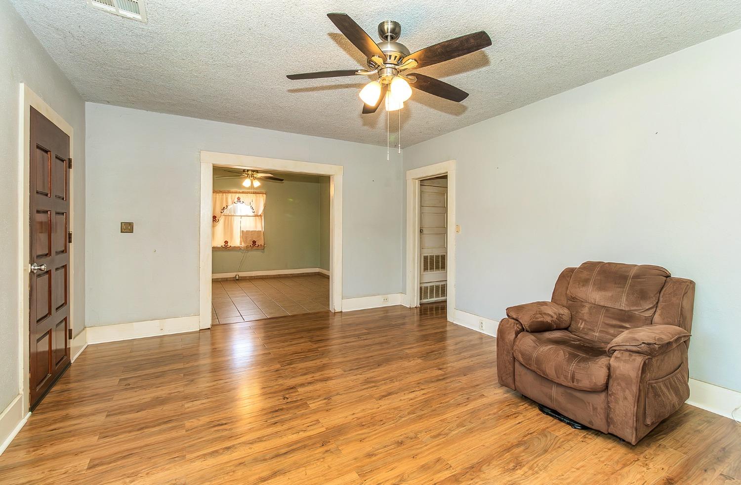 37991 Pound Road Dinuba, CA 93618 - Photo 16 of 32 a living room with furniture and a wooden floor