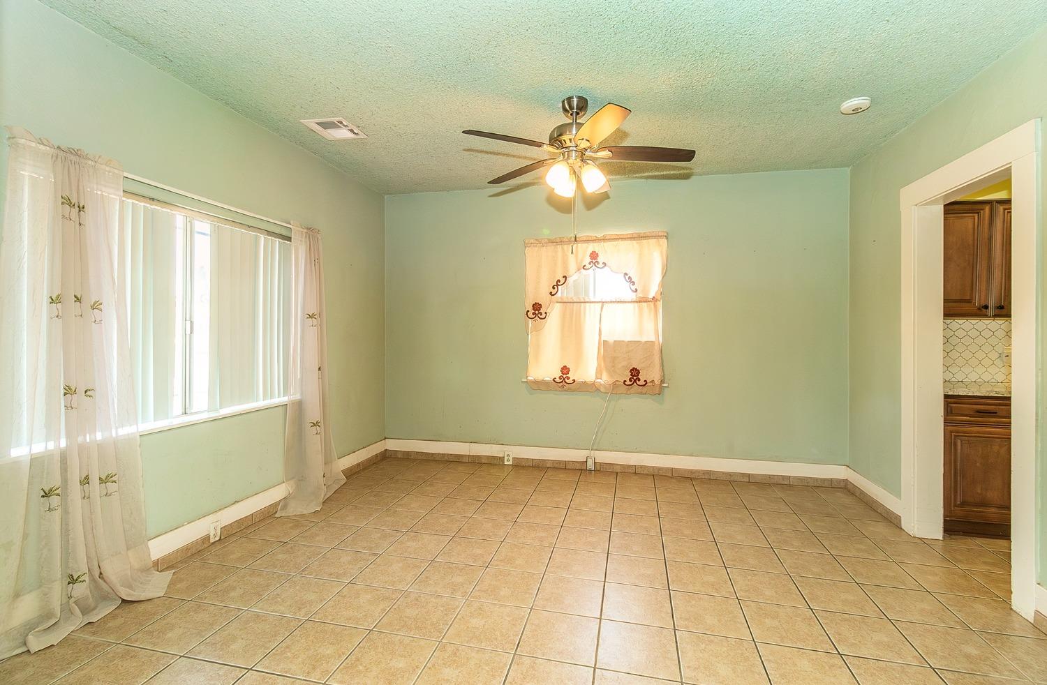 37991 Pound Road Dinuba, CA 93618 - Photo 17 of 32 a view of an empty room with a window