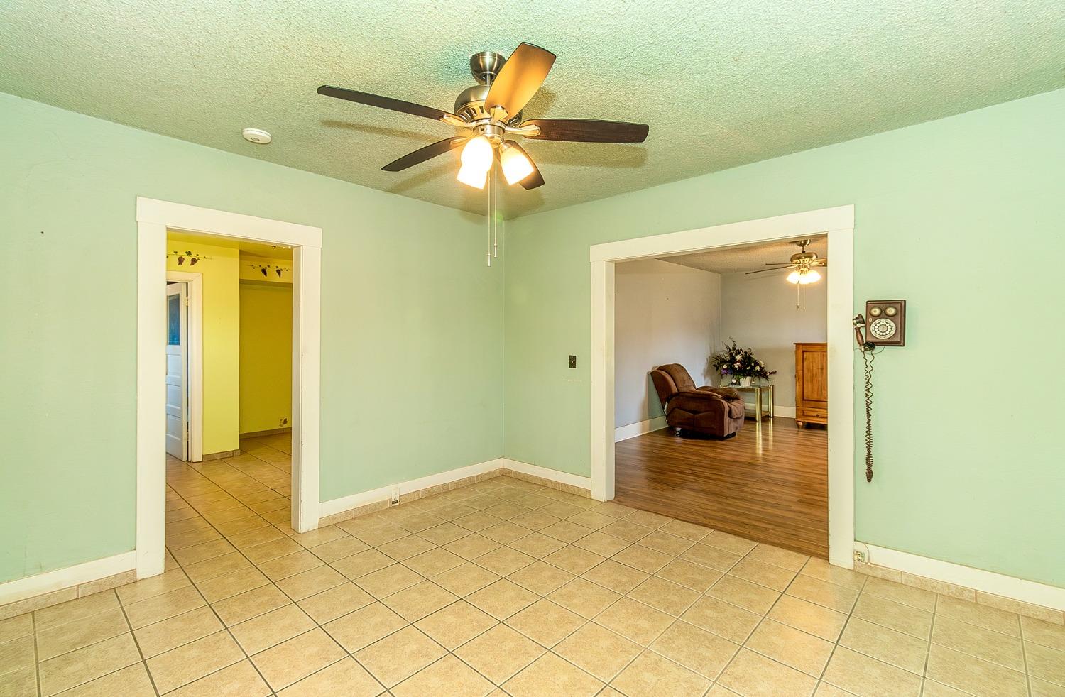 37991 Pound Road Dinuba, CA 93618 - Photo 18 of 32 a view of a livingroom and a dining room and chandelier fan