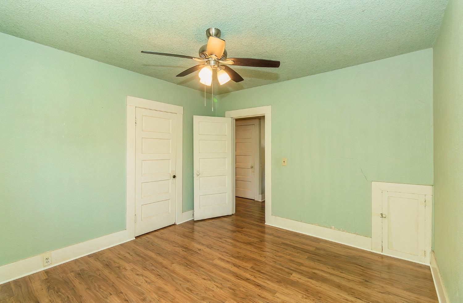 37991 Pound Road Dinuba, CA 93618 - Photo 23 of 32 a view of an empty room with wooden floor