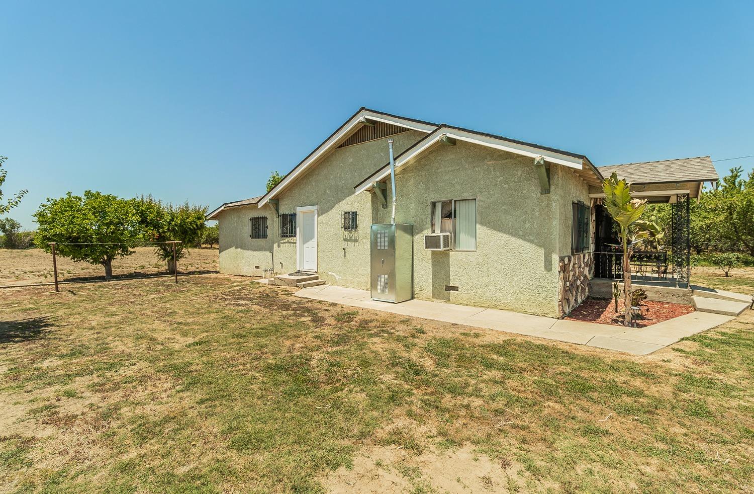 37991 Pound Road Dinuba, CA 93618 - Photo 27 of 32 a view of a house with a outdoor space