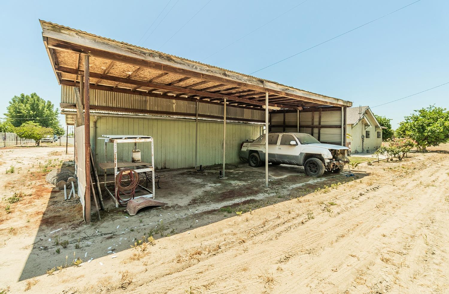 37991 Pound Road Dinuba, CA 93618 - Photo 32 of 32 a view of a chair and tables in patio