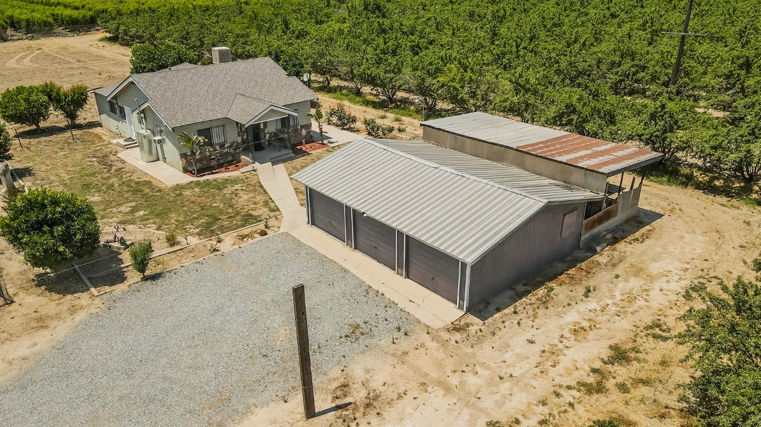 37991 Pound Road Dinuba, CA 93618 - Photo 5 of 32 a view of a house with a yard and covered with snow