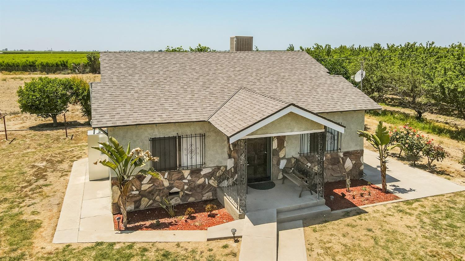 37991 Pound Road Dinuba, CA 93618 - Photo 6 of 32 a front view of house with yard outdoor seating and covered with trees