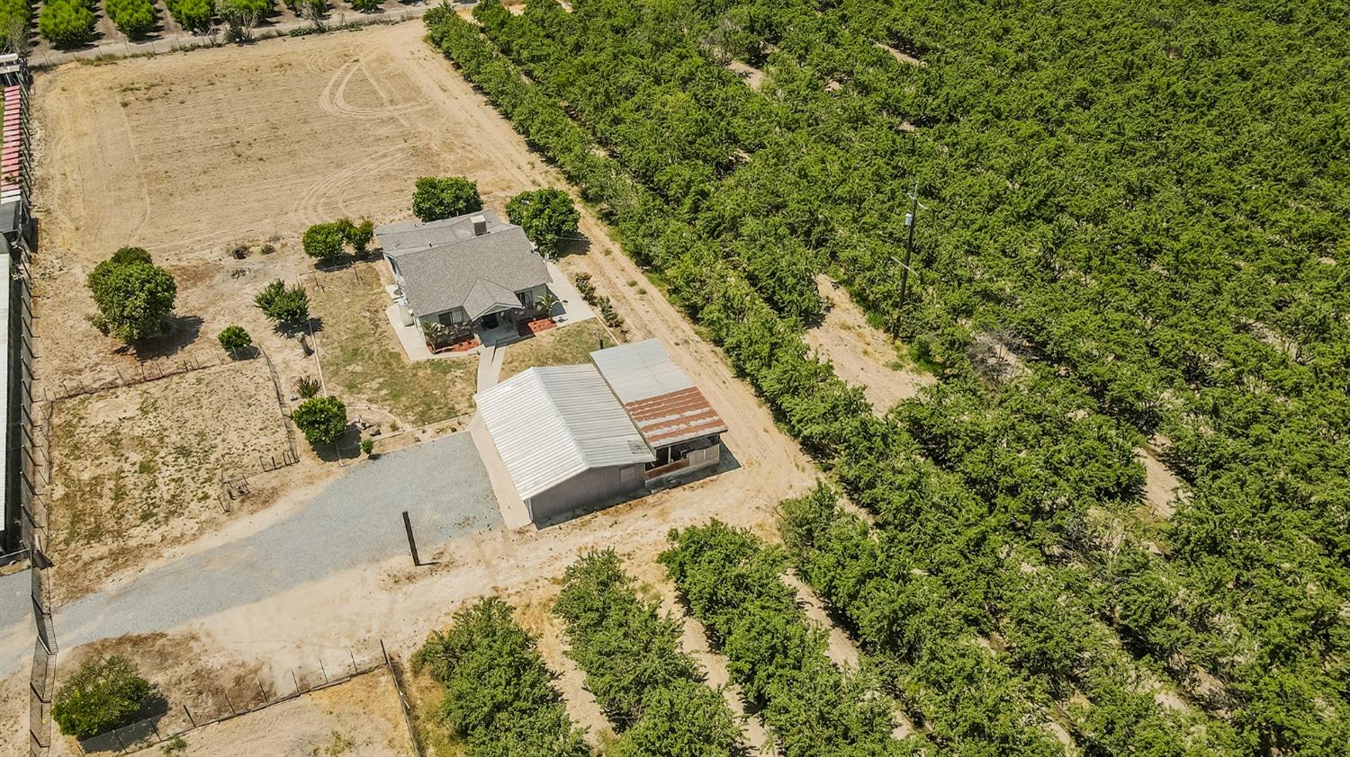 37991 Pound Road Dinuba, CA 93618 - Photo 8 of 32 an aerial view of residential house with outdoor space