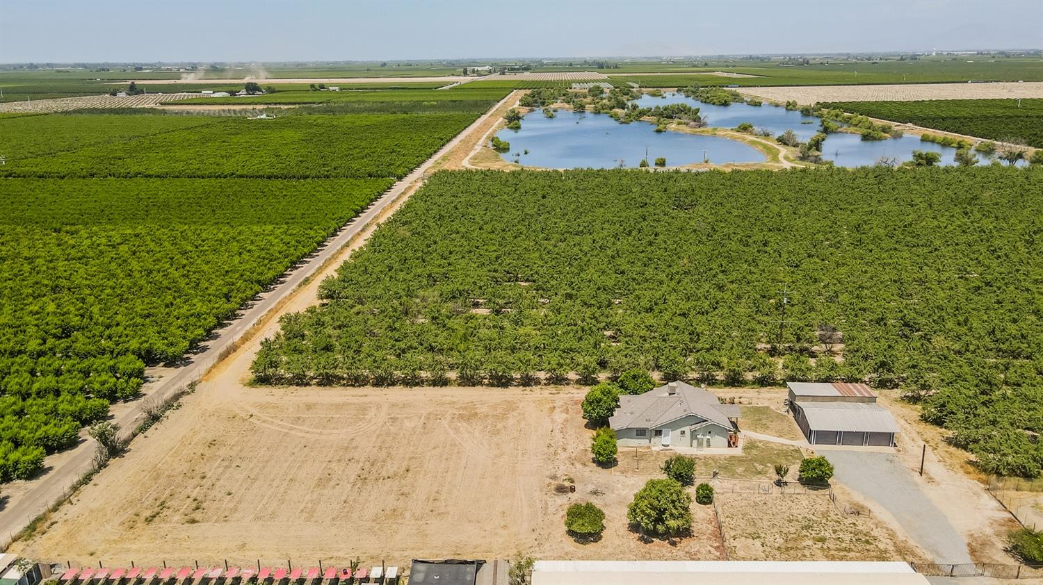 37991 Pound Road Dinuba, CA 93618 - Photo 10 of 32 a view of a swimming pool and a yard