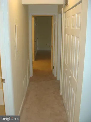 a view of a bathroom from a hallway