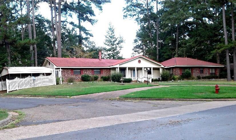 607 5th Street Northeast Springhill, LA 71075 - Photo 1 of 1 a view of a big yard in front of a house