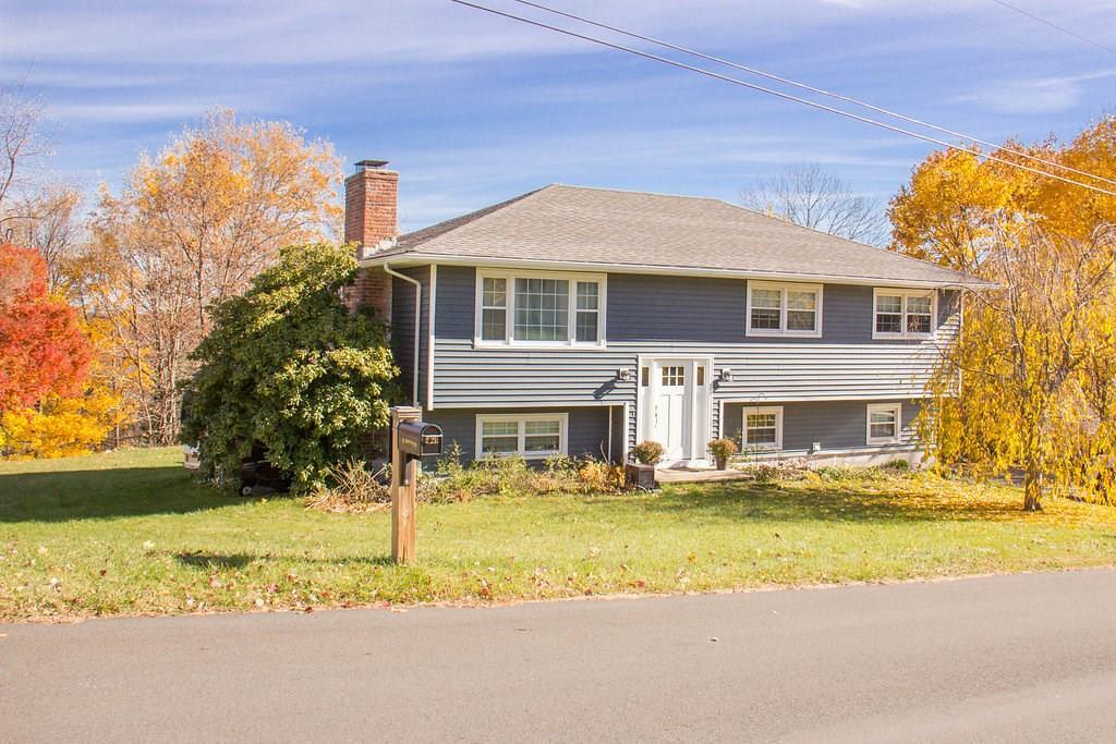 a front view of a house with a yard