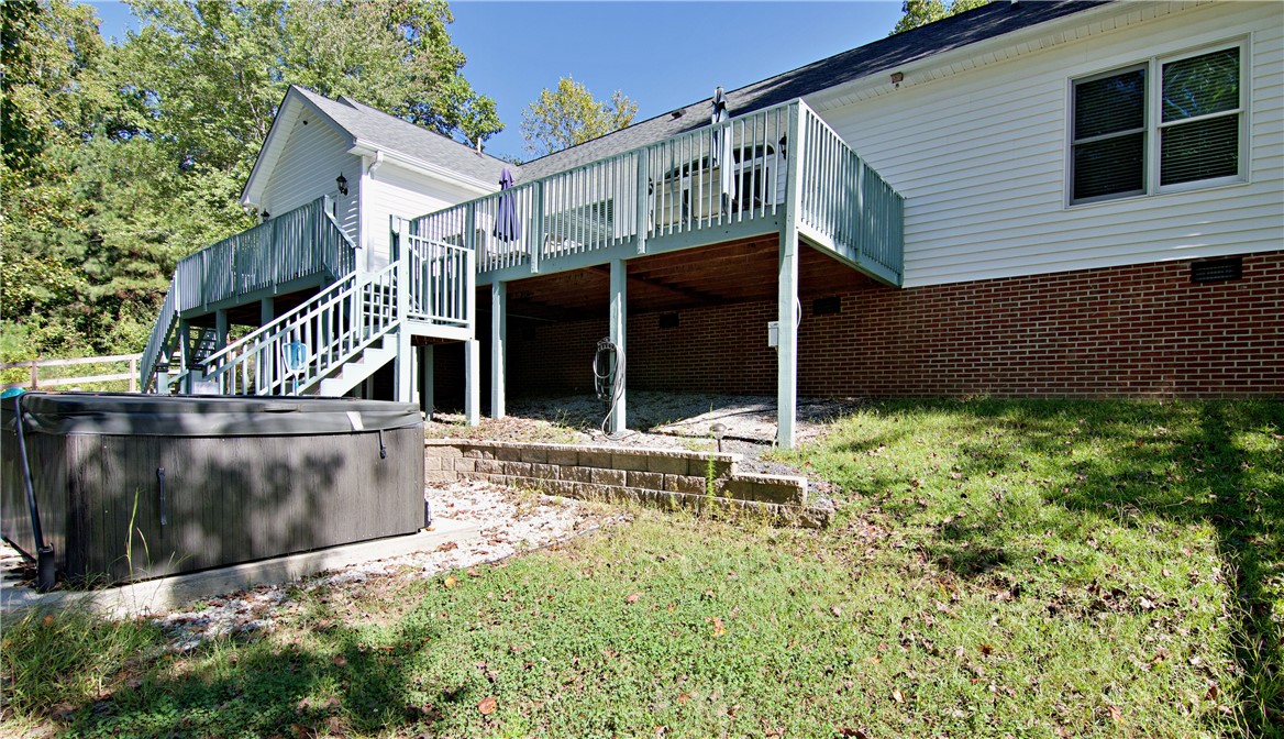 206 Petty Road Seneca, SC 29672 - Photo 49 of 49 An elevated wooden deck spans the rear exterior of this brick and siding home.