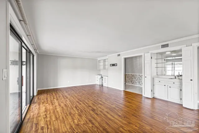 a bathroom with a double vanity sink a mirror and a shower
