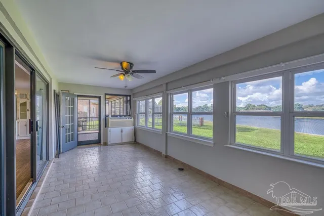 a view of a lake with houses in the back