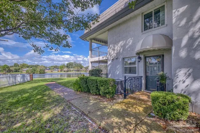 a view of a porch with a iron gate