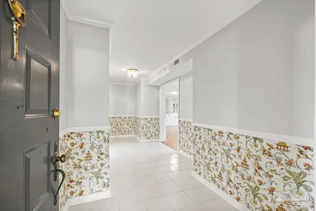 a kitchen with stainless steel appliances kitchen island granite countertop a refrigerator and a stove top oven