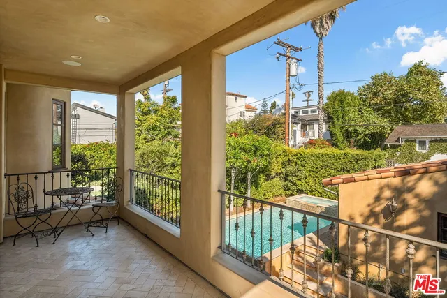 a view of a balcony with furniture