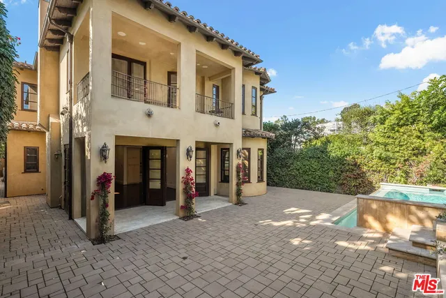 a view of a building with a yard