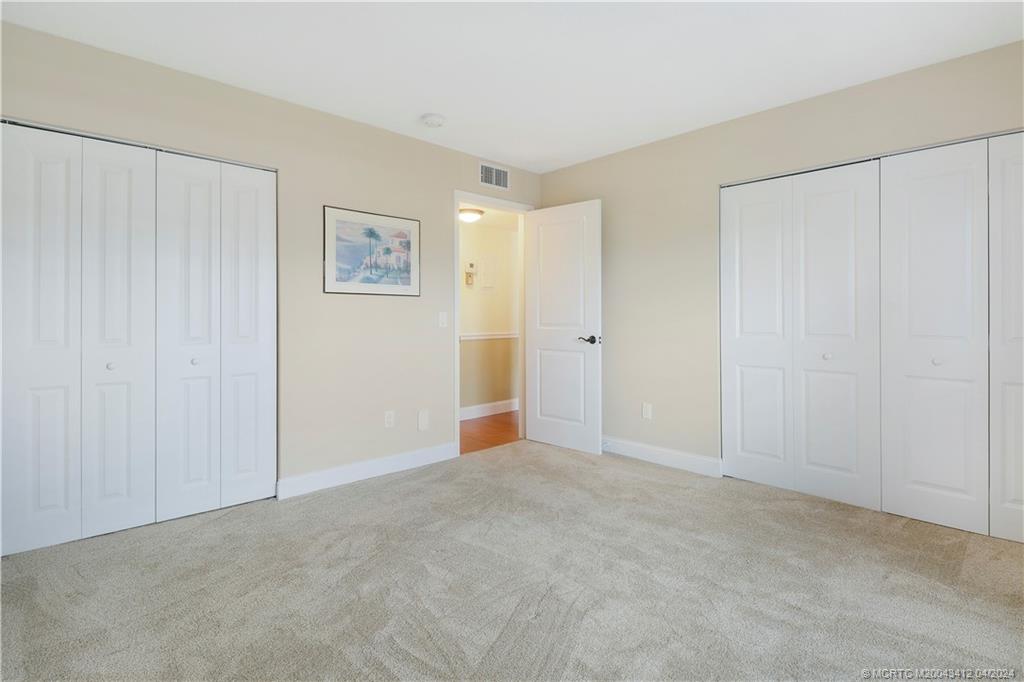 1864 Southwest Palm City Road, Unit 202 Stuart, FL 34994 - Photo 21 of 29 features double closets