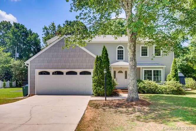 418 Park Ridge Road Albemarle, NC 28001 - Photo 1 of 28 a front view of a house with a yard and garage