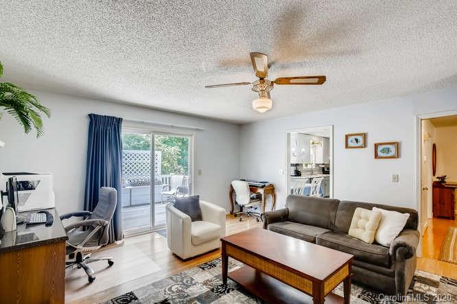 418 Park Ridge Road Albemarle, NC 28001 - Photo 15 of 28 a living room with furniture a ceiling fan a rug and a window