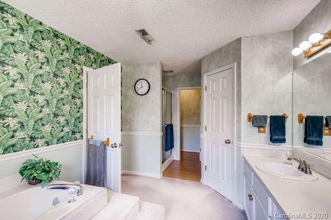 418 Park Ridge Road Albemarle, NC 28001 - Photo 20 of 28 a bathroom with a tub sink and mirror