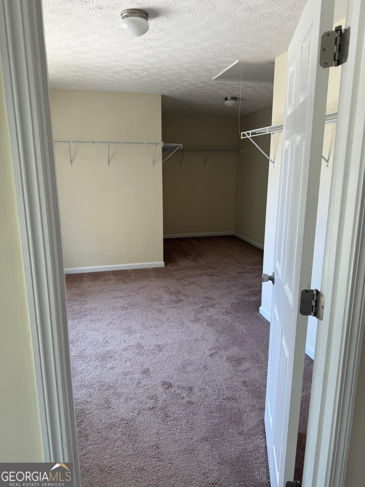 2909 Rusticwood Drive Southwest Snellville, GA 30078 - Photo 10 of 17 an empty room with a door
