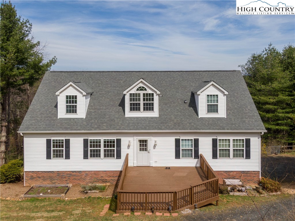 449 Meadow Ridge Drive Jefferson, NC 28640 - Photo 2 of 37 a front view of a house with a yard
