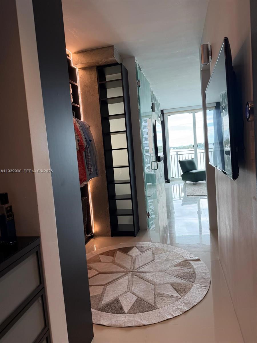 770 Northeast 69th Street, Unit 6F Miami, FL 33138 - Photo 15 of 47 a view of entryway and hall with wooden floor