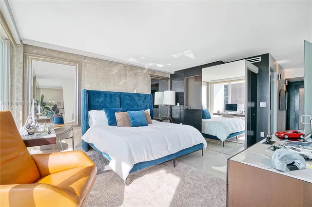 a view of backyard with swimming pool and seating area