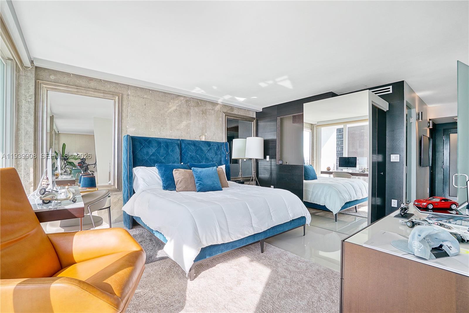 770 Northeast 69th Street, Unit 6F Miami, FL 33138 - Photo 20 of 47 a bedroom with a bed and glass windows