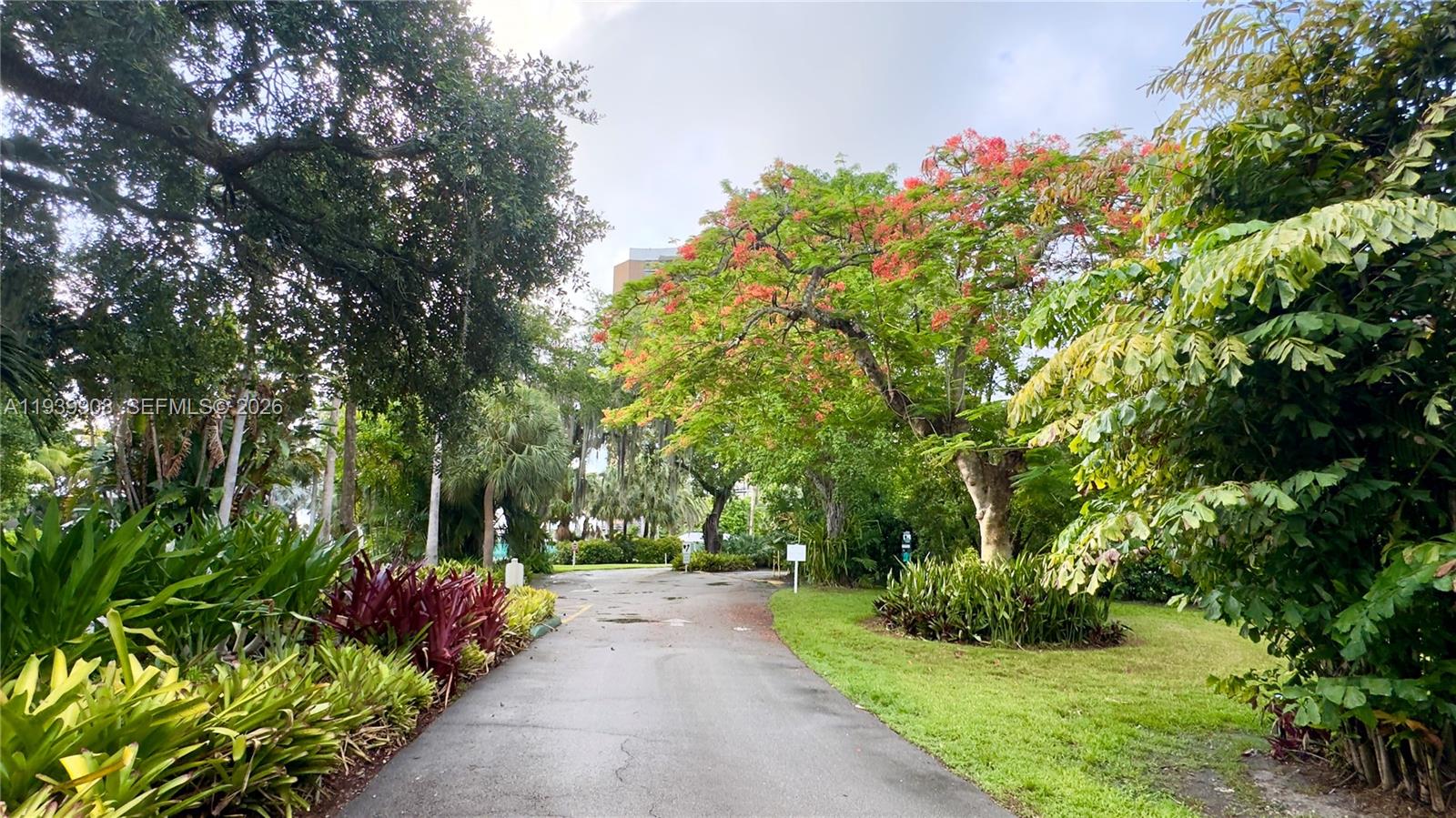 770 Northeast 69th Street, Unit 6F Miami, FL 33138 - Photo 27 of 47 a view of a garden with flowers