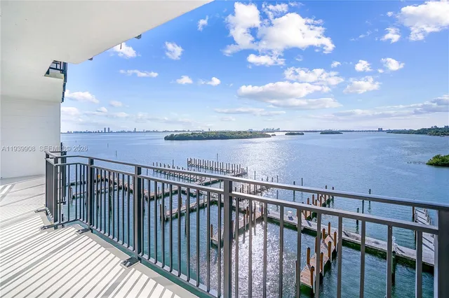 a green field with lots of trees