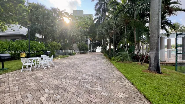 a view of a house with a yard and entertaining space