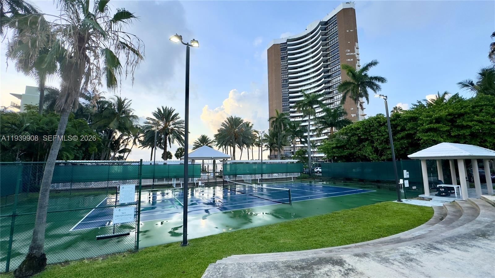 770 Northeast 69th Street, Unit 6F Miami, FL 33138 - Photo 32 of 47 a view of a swimming pool with a garden