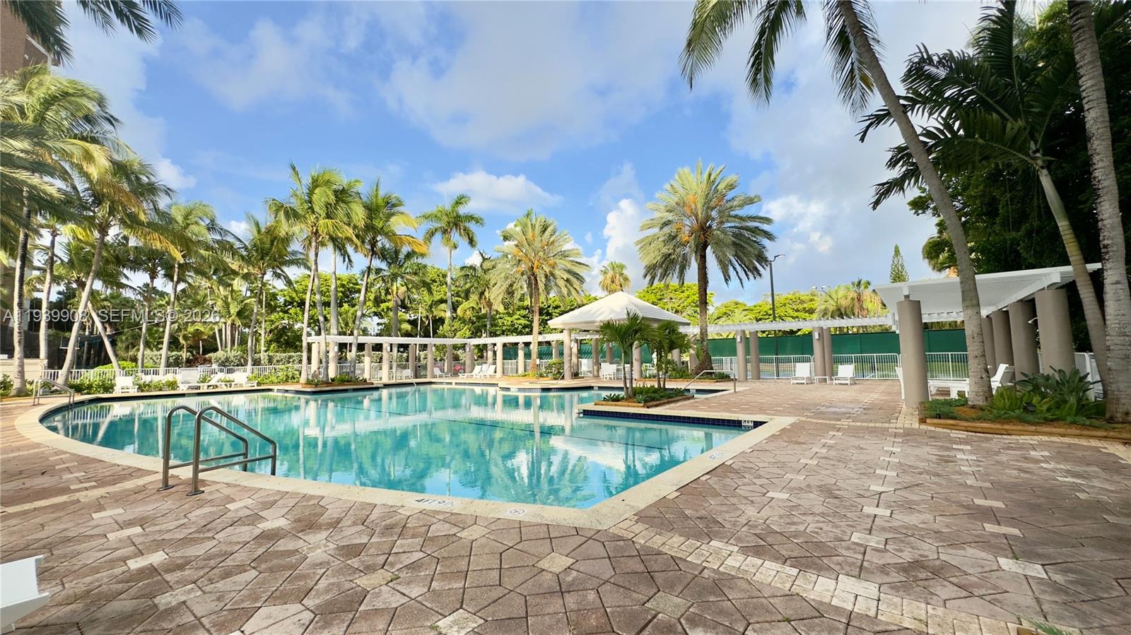 770 Northeast 69th Street, Unit 6F Miami, FL 33138 - Photo 33 of 47 a view of a swimming pool with a patio