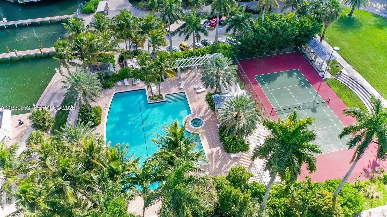 770 Northeast 69th Street, Unit 6F Miami, FL 33138 - Photo 40 of 47 an aerial view of a house with a yard and a water fountain