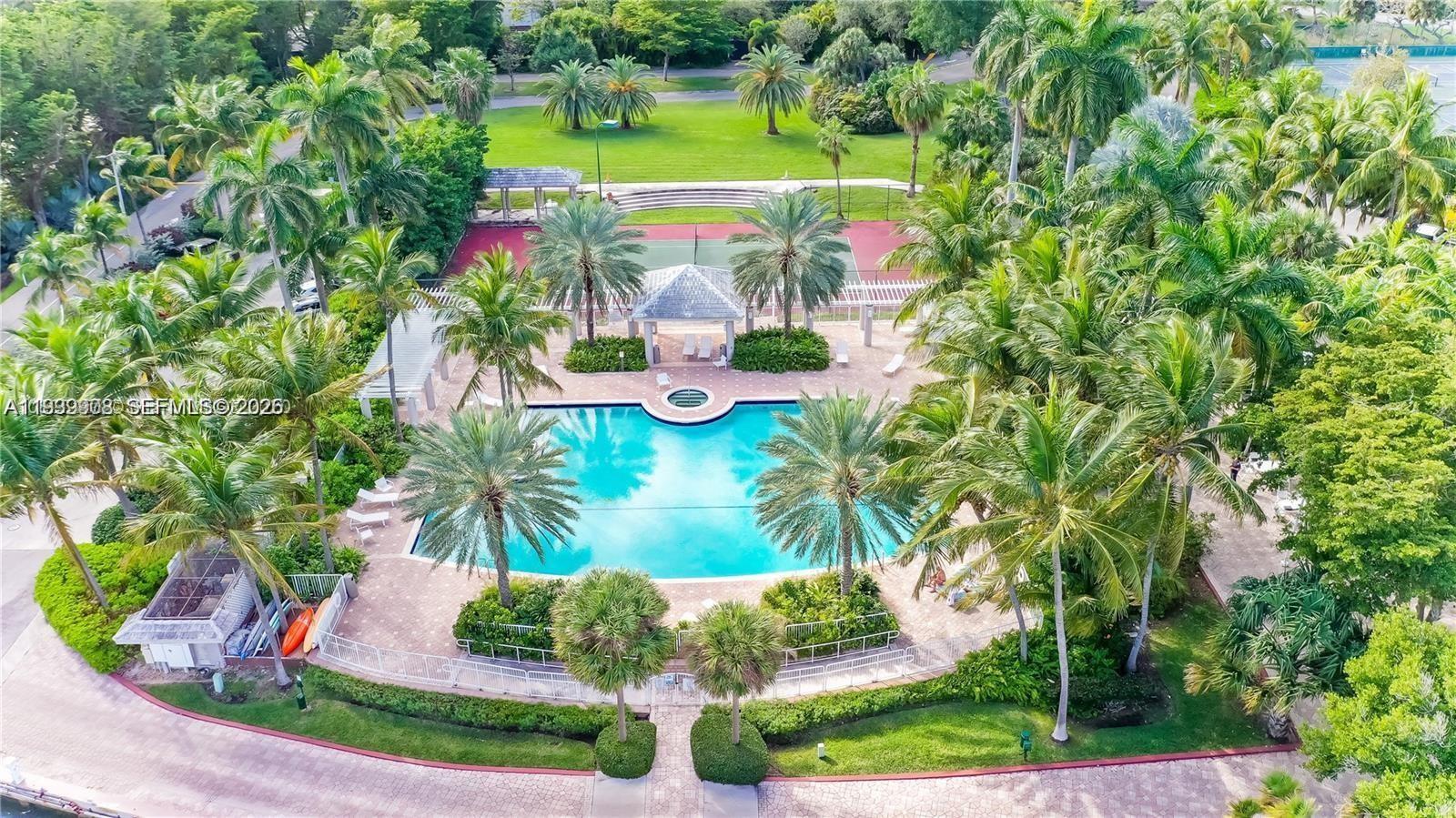 770 Northeast 69th Street, Unit 6F Miami, FL 33138 - Photo 42 of 47 an aerial view of a house with a garden and swimming pool