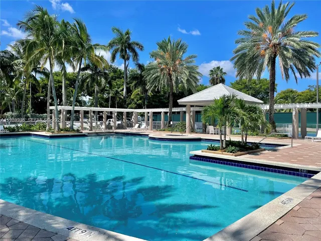 a view of a swimming pool with lounge chairs