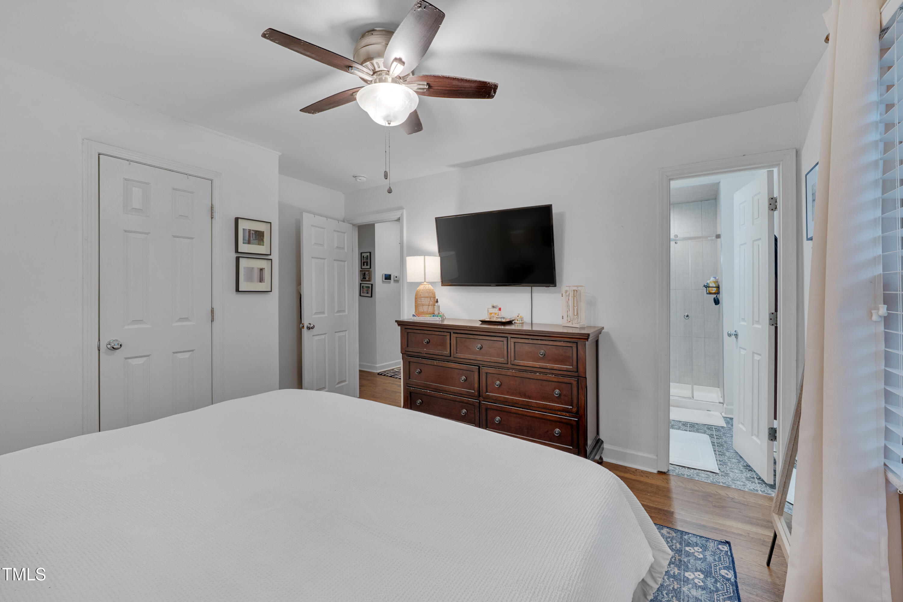 2442 Stevens Road Raleigh, NC 27610 - Photo 12 of 22 a bedroom with a bed and a flat screen tv