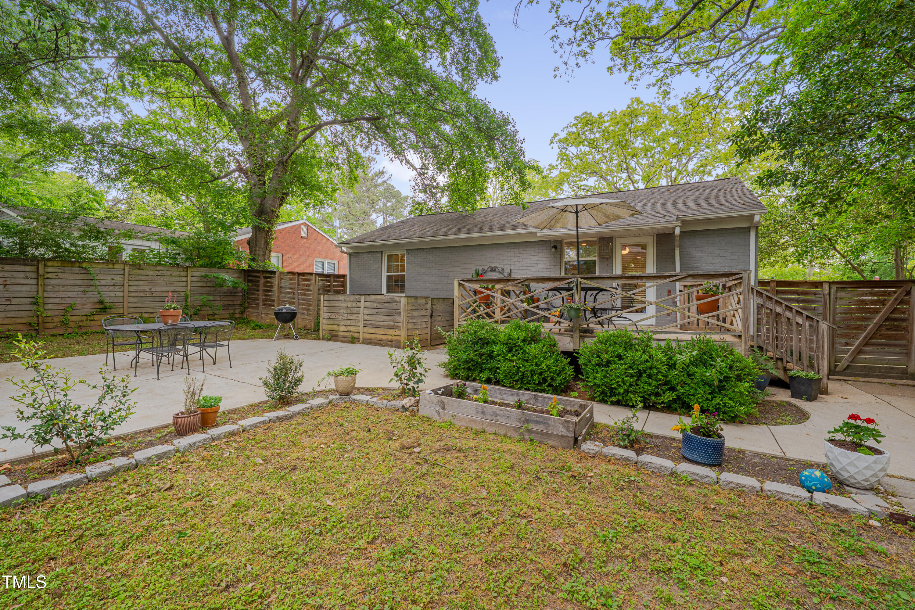 2442 Stevens Road Raleigh, NC 27610 - Photo 20 of 22 a view of a house with a yard and a large tree