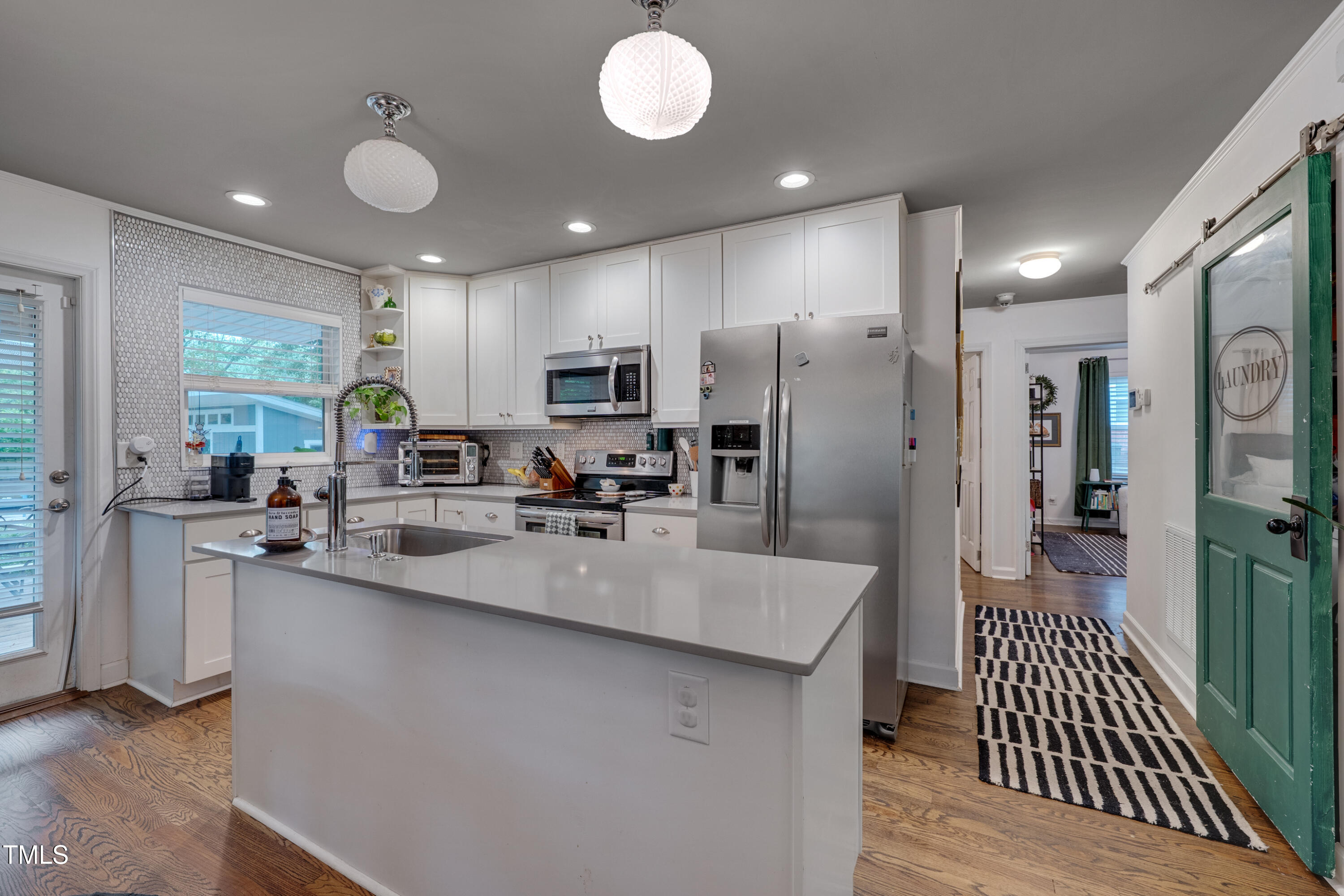2442 Stevens Road Raleigh, NC 27610 - Photo 7 of 22 a large kitchen with stainless steel appliances lots of counter space and a sink