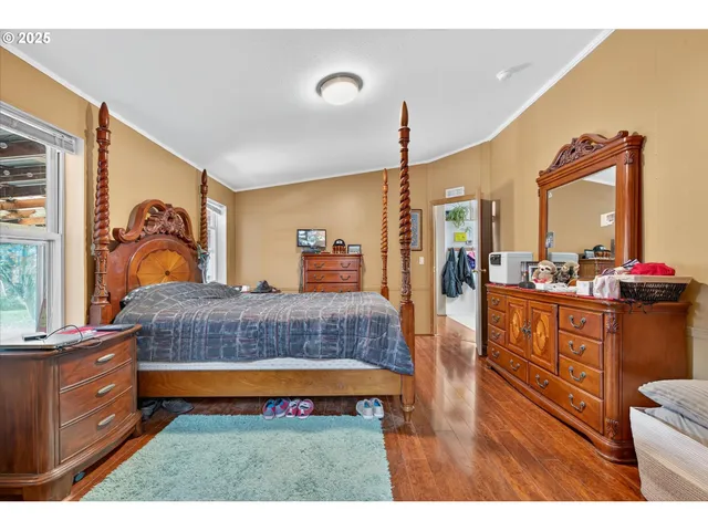 a bedroom with a bed and dresser