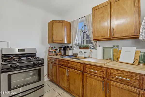a kitchen with cabinets and appliances