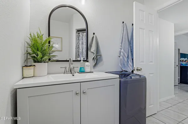 a bathroom with a sink and a mirror
