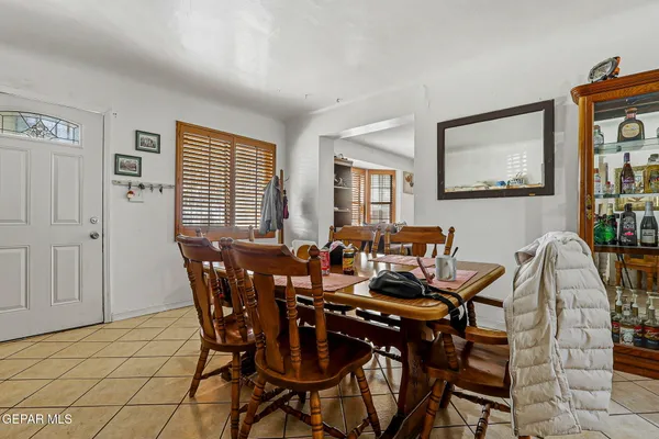 a view of a dining room with furniture and window