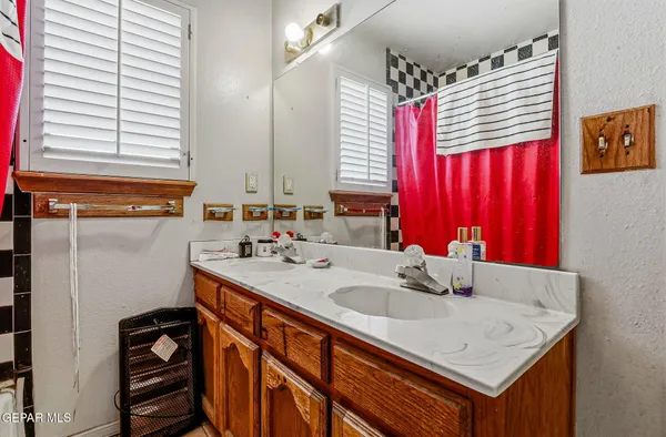 a bathroom with a sink and a mirror