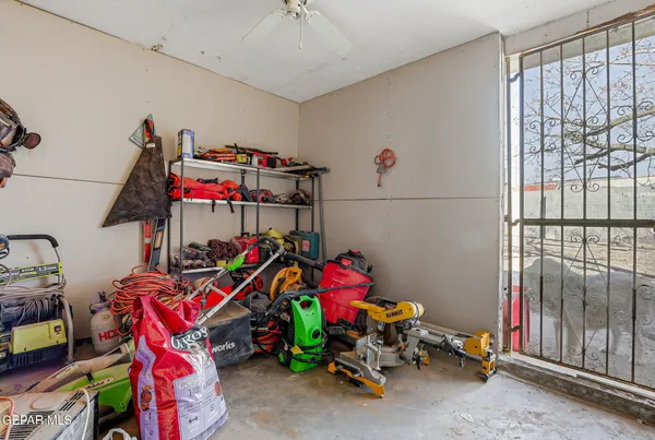 a view of a backyard with wooden fence