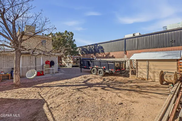 an aerial view of residential house with outdoor space and parking