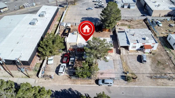 an aerial view of a city and mountain view in back