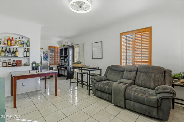 a living room with furniture and a window